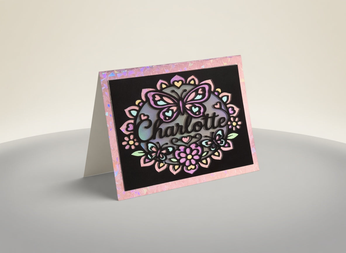 Personalised butterfly name card standing on a table, a handmade UK gift